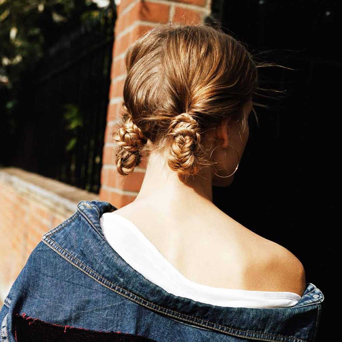 Twisted sista: A kooky combo of two fishtail braids and low knots - twisted together to form an updated up-do with undone charm.